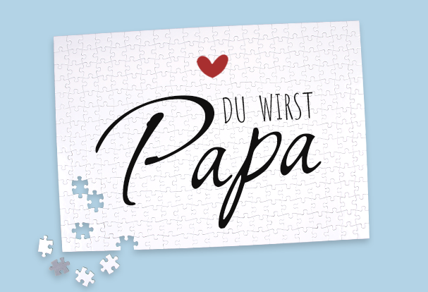 Puzzle als kreative Babyankündigung für Papa Ein weißes Puzzle mit der Botschaft „Du wirst Papa“ als originelles und individuelles Babygeschenk zur Geburt.
